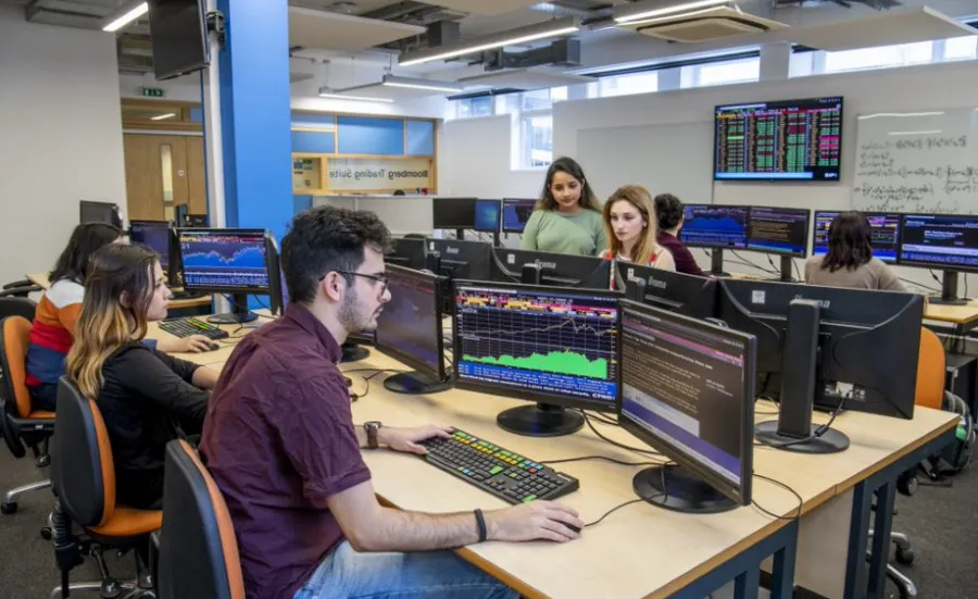 Students working at the Bloomberg terminals in the financial laboratory.