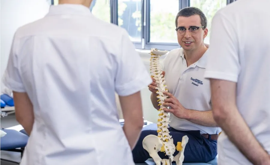 Physiotherapy students studying anatomy in a clinical skills space