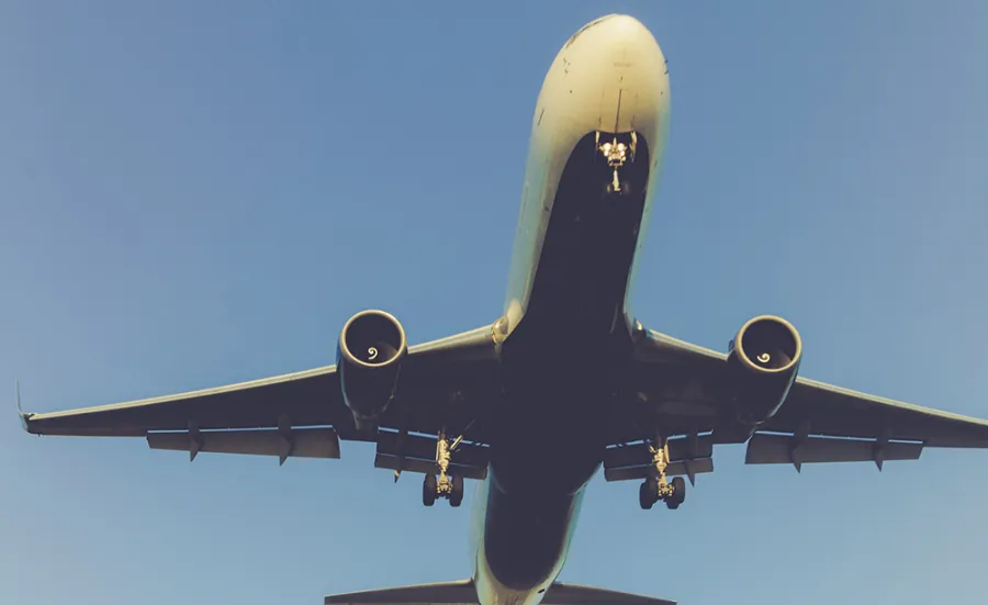 A large passenger plane flying close overhead