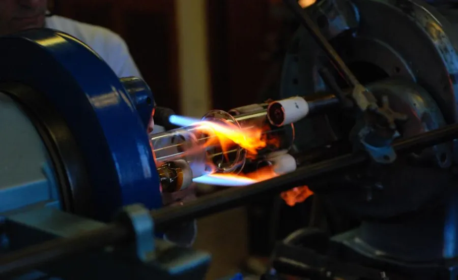 Glassblowing expert creating customised glassware in a workshop