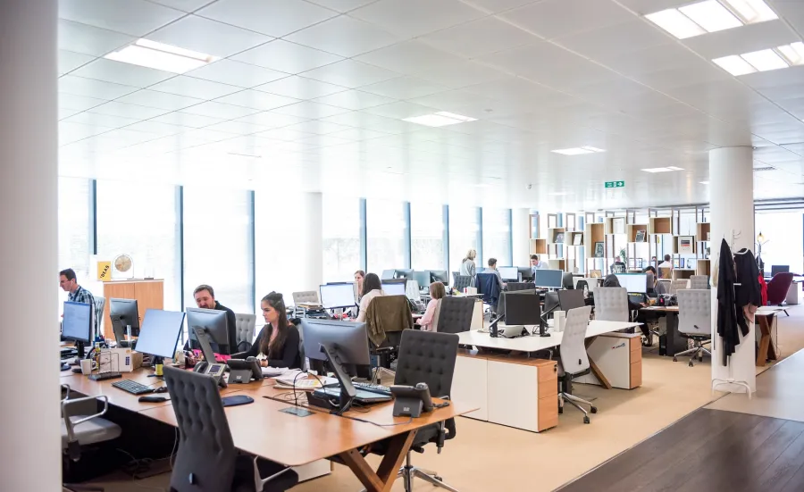 Image showing people working in a large office space.