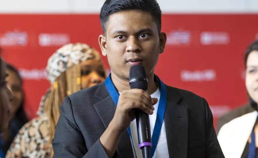 International student Karthik Saravan presenting at a conference