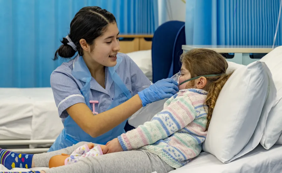 student nurse with patient