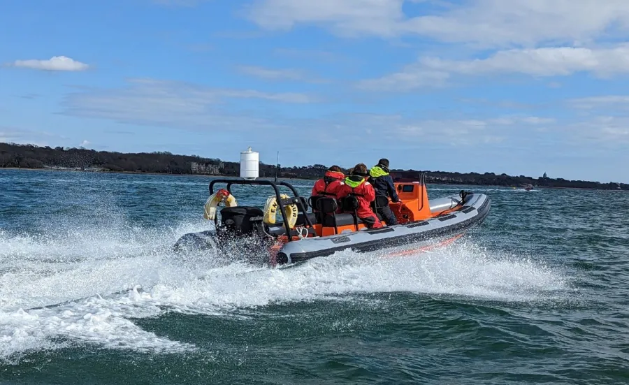 Powerboat moving away from the camera