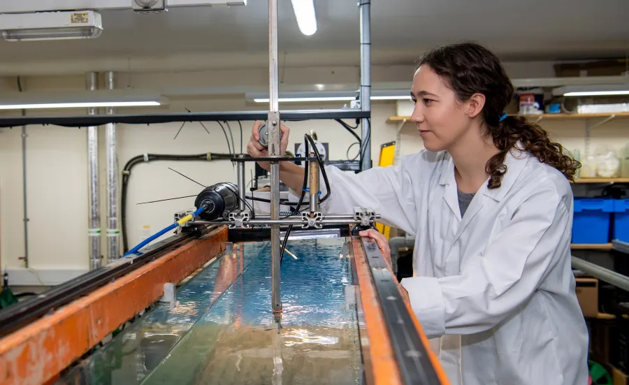 One researcher doing a flume experiment examining flow over seagrass mimics