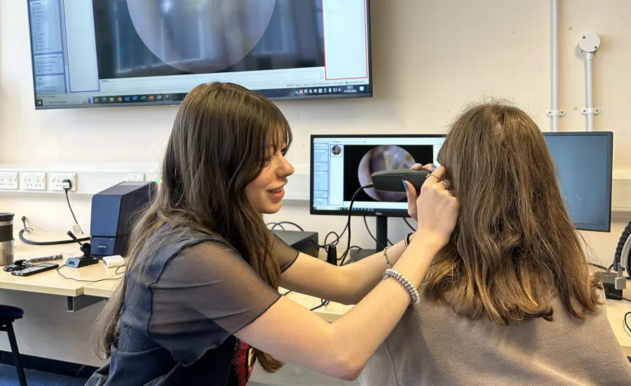 Isabel-McGauley examining patient