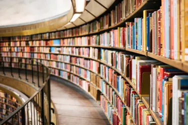 Rows of books on shelves in a library