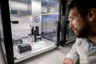 Scientist looking at lab equipment