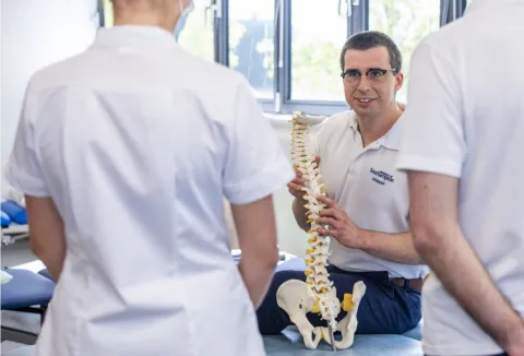 Physiotherapy students studying anatomy in a clinical skills space