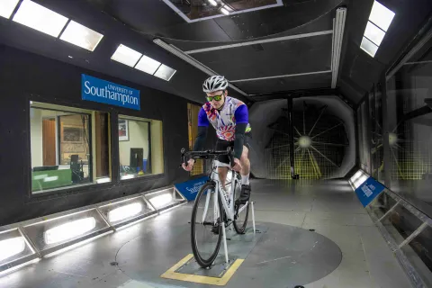 Cyclist takes part in an aerodynamics experiment in the R J Mitchell wind tunnel