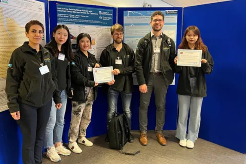 Group of people posing with their certificates