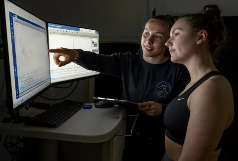 A researcher and participant discussing test results