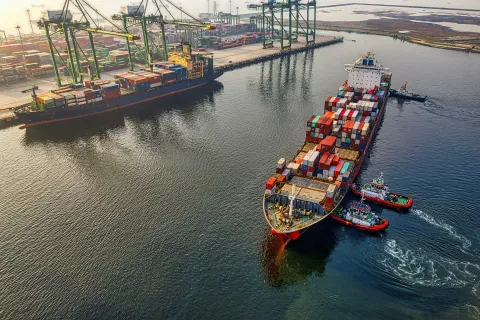 Cargo ships on water in docks