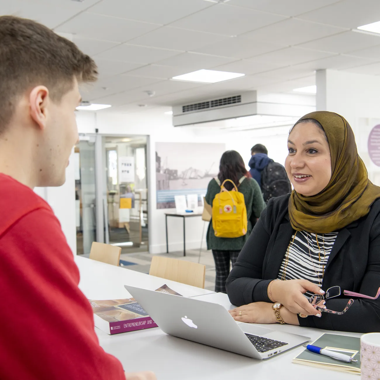 Tutor and student in discussion.