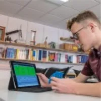 computer systems student working on a tablet