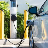 An electric car refuels at a charging point