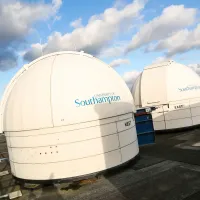 The East and West observatories atop the ƱAPP_ĿͲƱ-ٷϷ, physics and astronomy building at Highfield Campus.