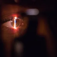 A person having their eye scanned