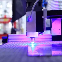 A pulsed fibre laser cutting through metal