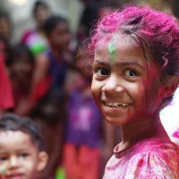 Selective focus photo of girl in shirt smiling 