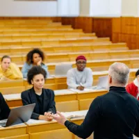 Lecturer and students in a lecture theatre