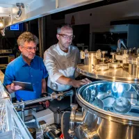 Jeremy Frey and Bill Brockleby observing nanoscale imaging of neurons equipment