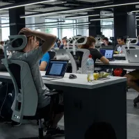 Workers in a digital technology company working in an open-plan office space