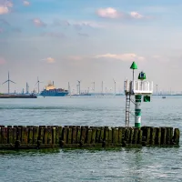 A cargo ship leaving a harbour