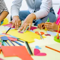 Children playing with toys and arts and crafts